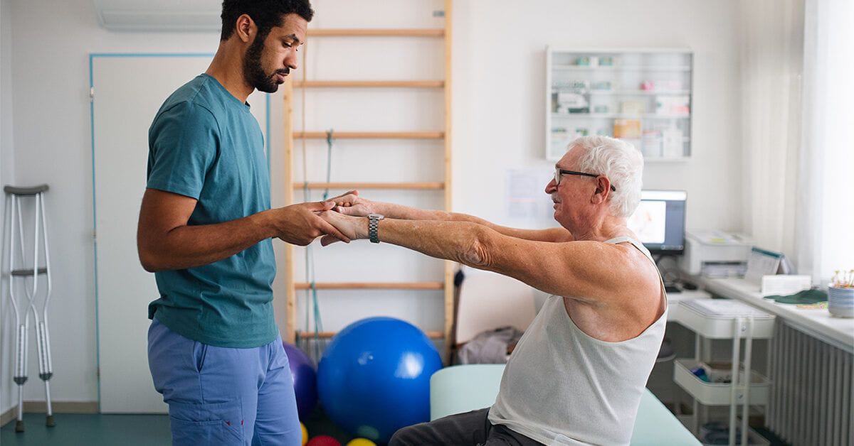 Home physiotherapy session in DHA Karachi - therapist treating patient at home