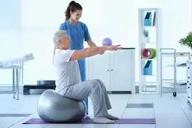 Elderly patient receiving home physiotherapy in DHA Karachi with family present